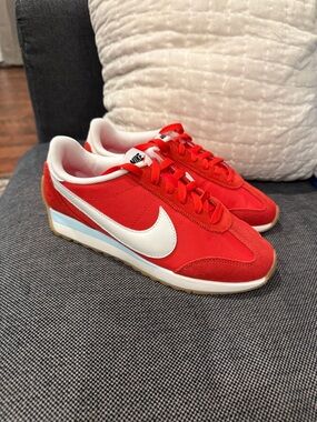Nike Pacific Red Low-Top Sneakers with White Swoosh and Light Blue Accent